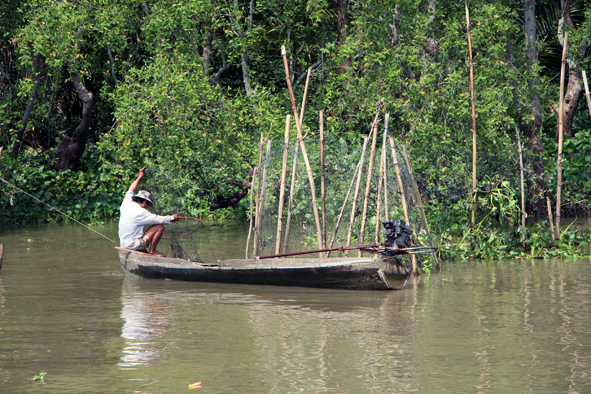Crossing the Vietnam-Cambodia border on a Mekong River ferry.