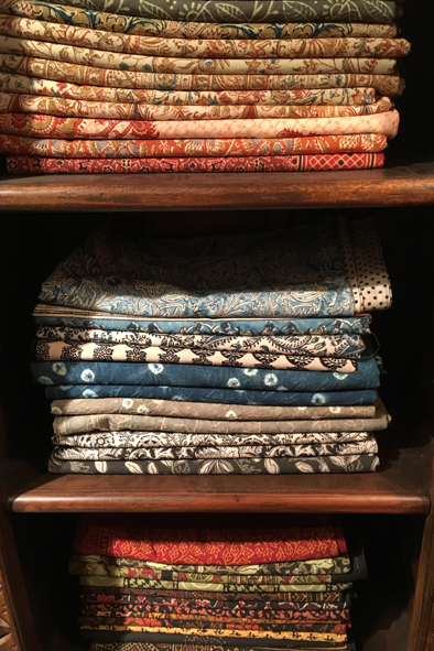 Shopping for hand-dyed fabrics at Maiwa Handprints in the Net Loft on Granville Island. vancouver, Canada