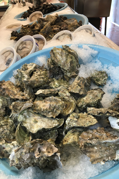 Fresh oysters for sale at the Granville Island Public Market.