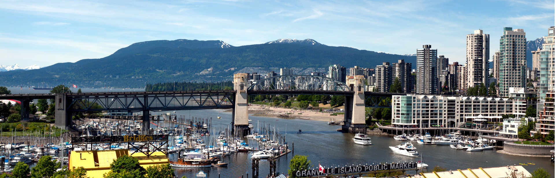 The view across Granville Island and False Creek to the mountains of North Vancouver in the distance.