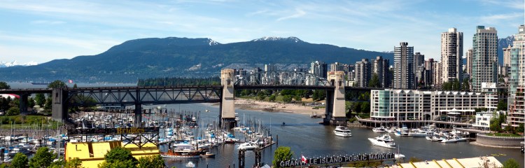 The view across Granville Island and False Creek to the mountains of North Vancouver in the distance.